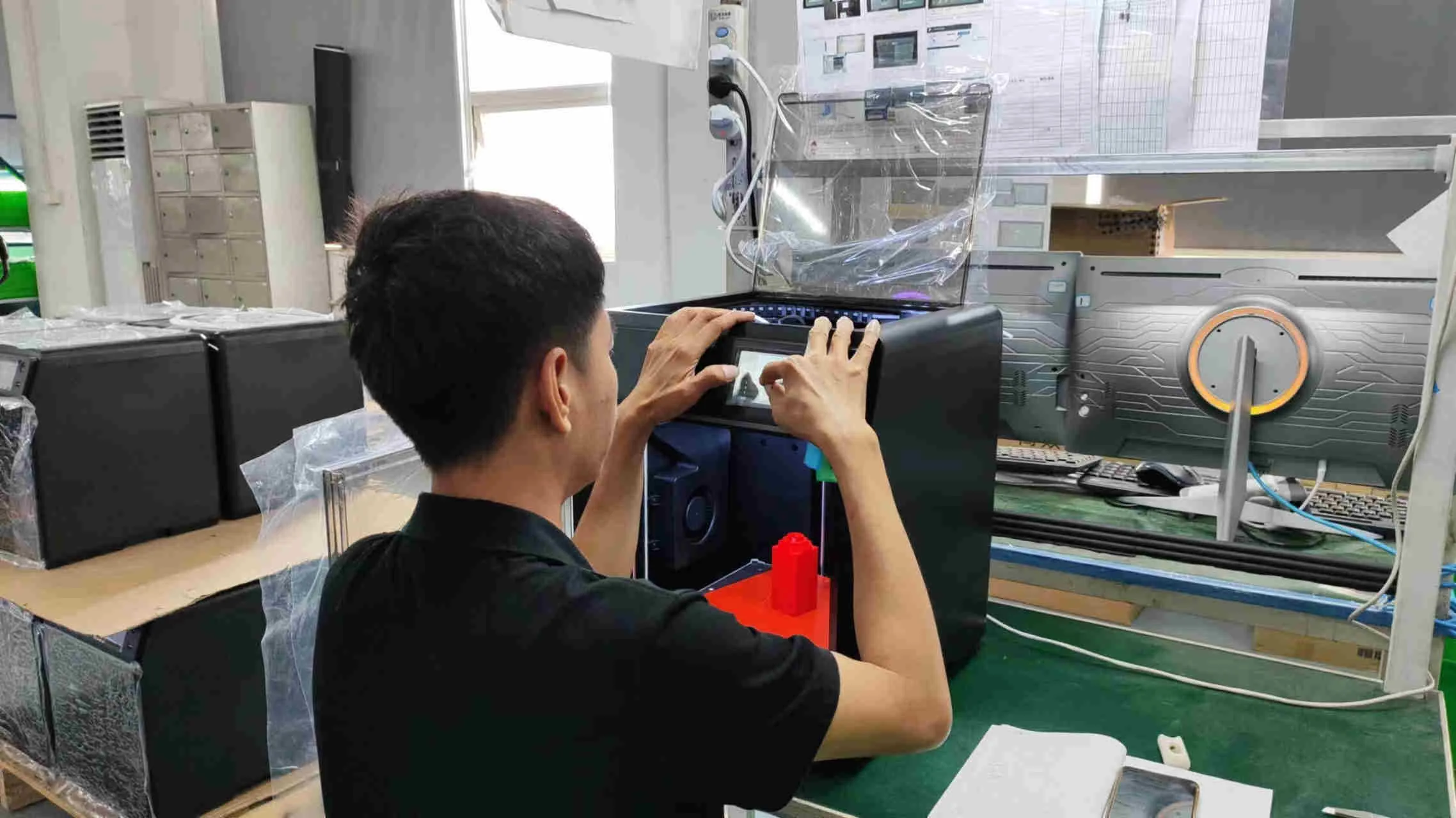 Functional inspection of a 3D printer before packing at a reviewed partner factory